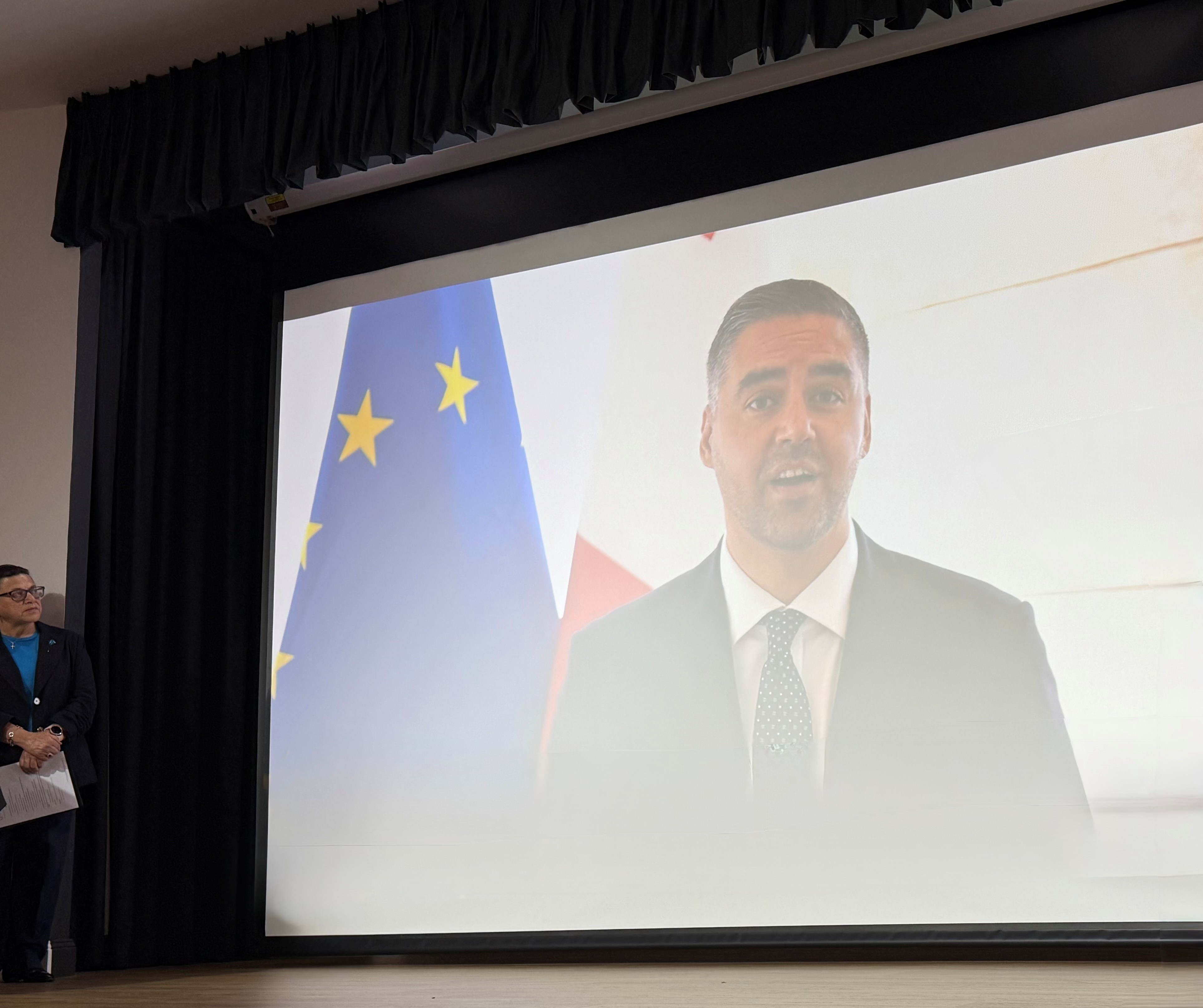 The Hon. Deputy Prime Minister and Minister for Foreign Affairs and Tourism, Ian Borg, delivers remarks via video message on the occasion of Malta’s Independence Day, shown during the Maltese Citizenship Award Ceremony in Sydney on 27 September 2025.