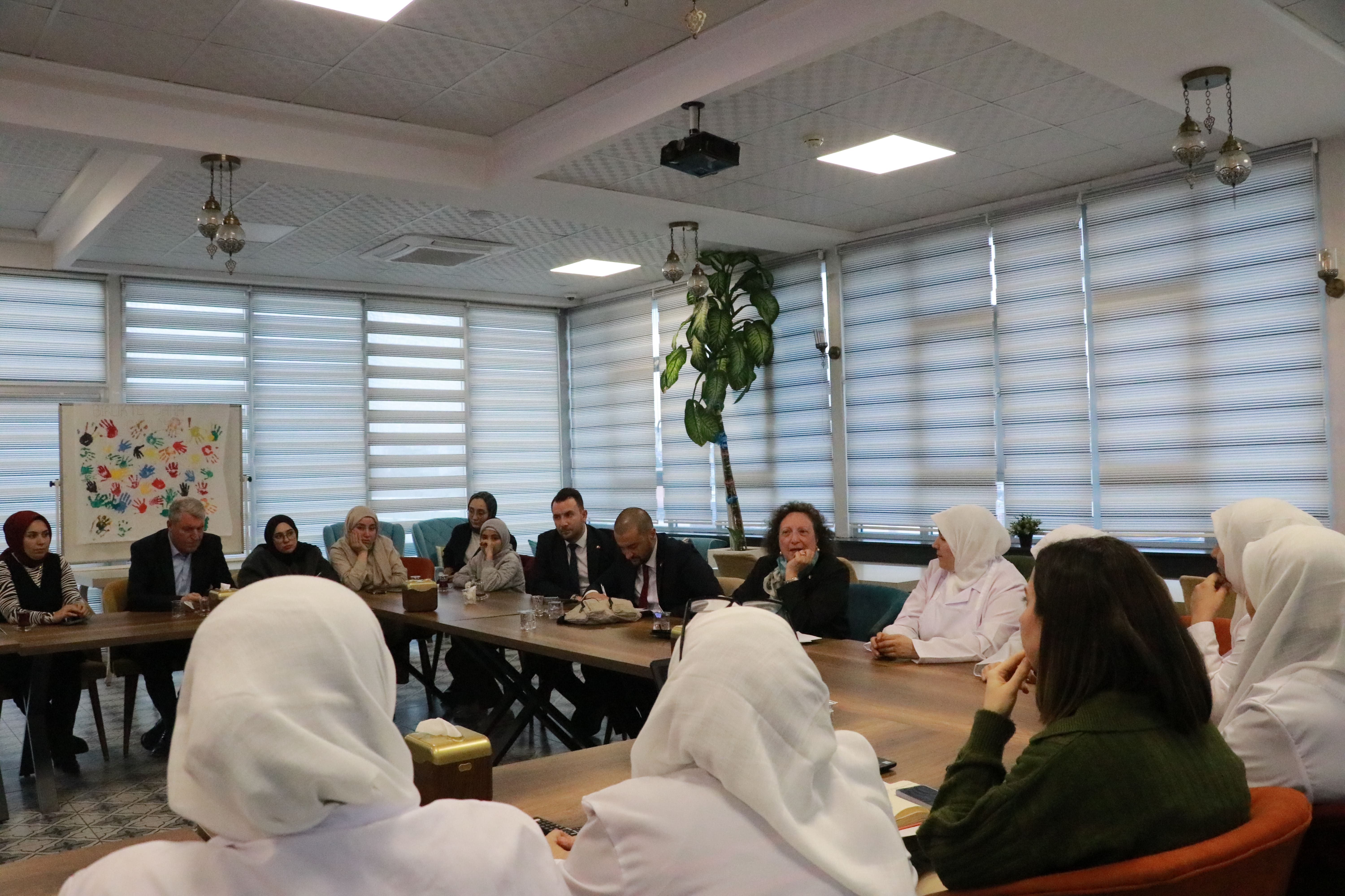 Ambassador Farrugia and Mr Calleja discussing the progress of the Hemdem Cooperative with the Syrian Migrant Chefs who benefit from the initative.