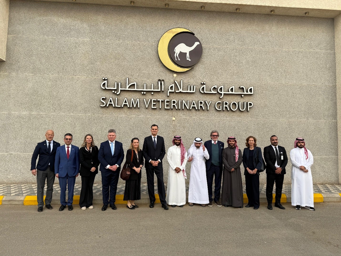 A group of people standing in front of a building.