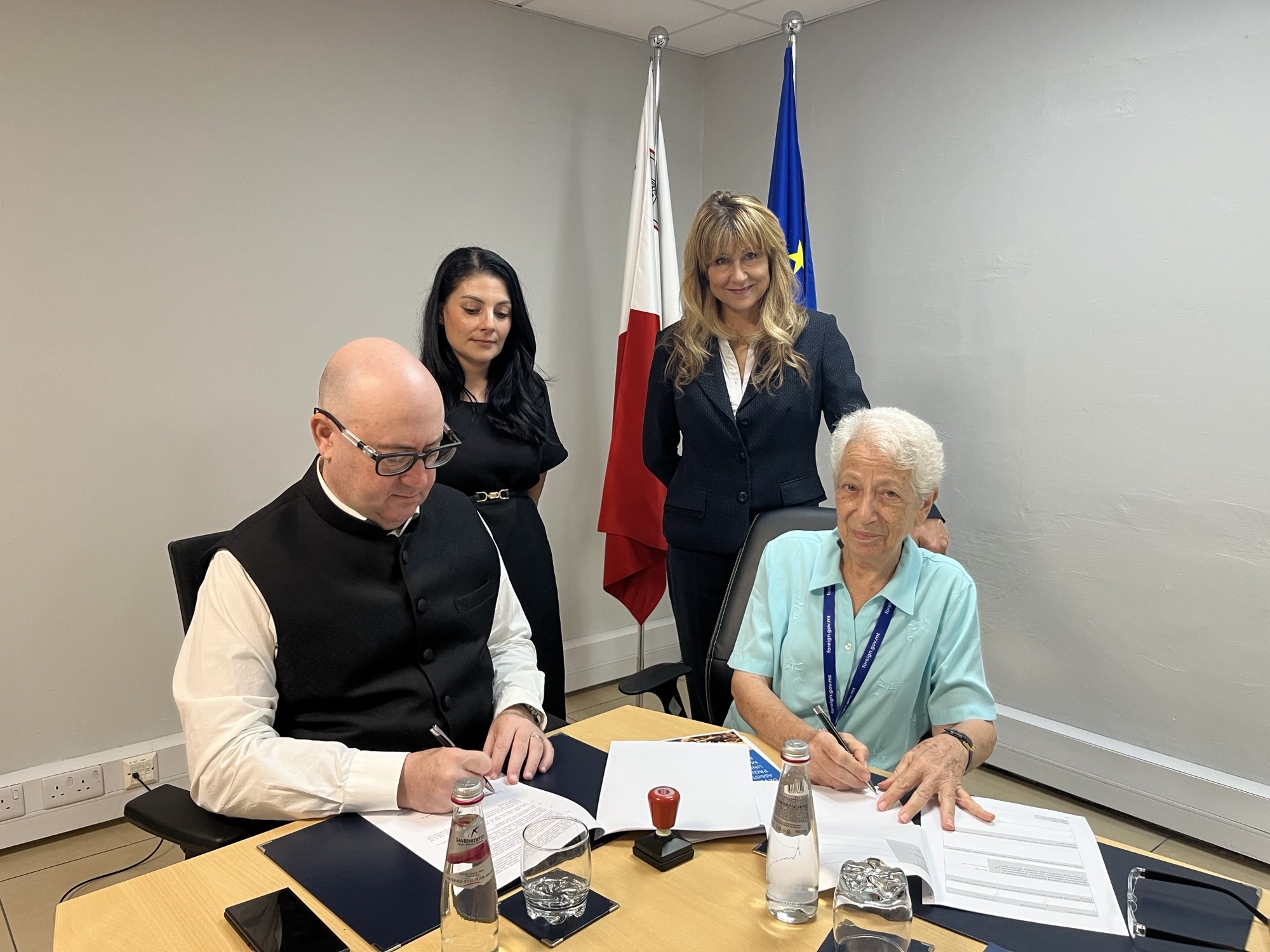 Sitting from Left to Right : High Commissioner of Malta to India H.E. Reuben Gauci and Maltese Missionary Ms Maria Concetta Buttigieg during their short visit to Malta in July 2026, taking the opportunity to sign the agreement at Head Office.
Standing from Left to Right: Director International Development and Economic Affairs Ms Alberta Borg and Senior Officer in International Development and Economic Affairs Dr Antoinette Calleja.